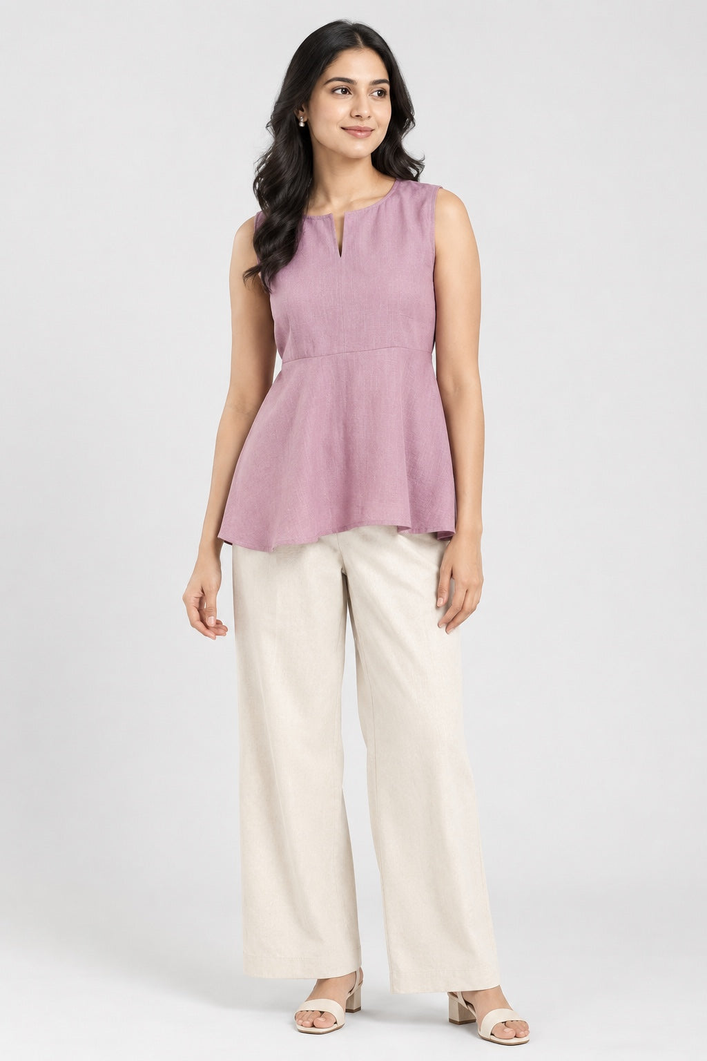 Women's pink sleeveless peplum top with split neckline